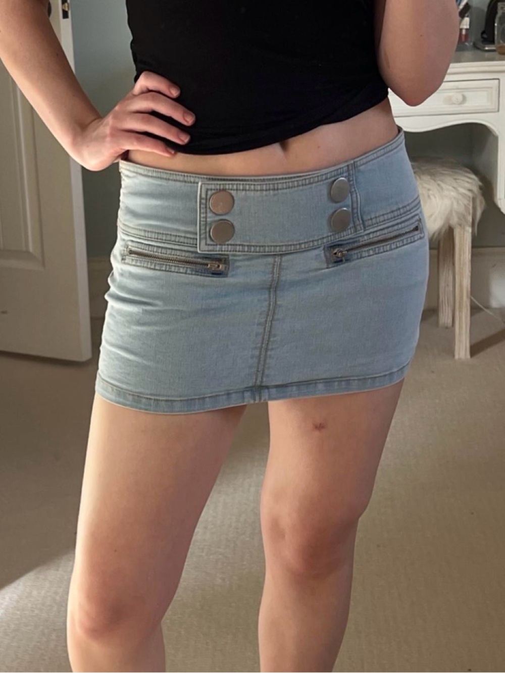 UO Light Wash Denim Low Waisted Mini Skirt with Silver Button Detail